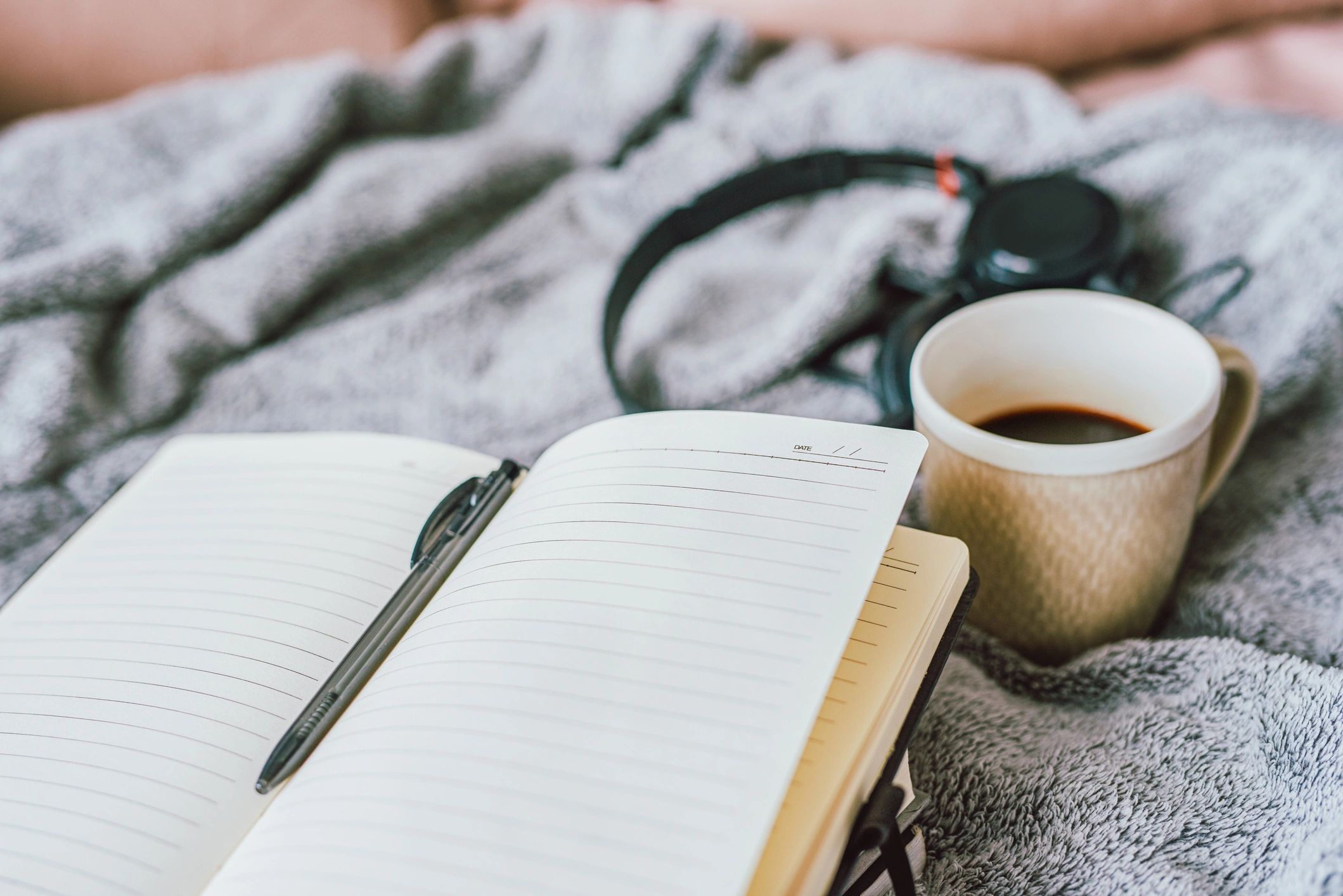Notebook and coffee for reflection and journaling