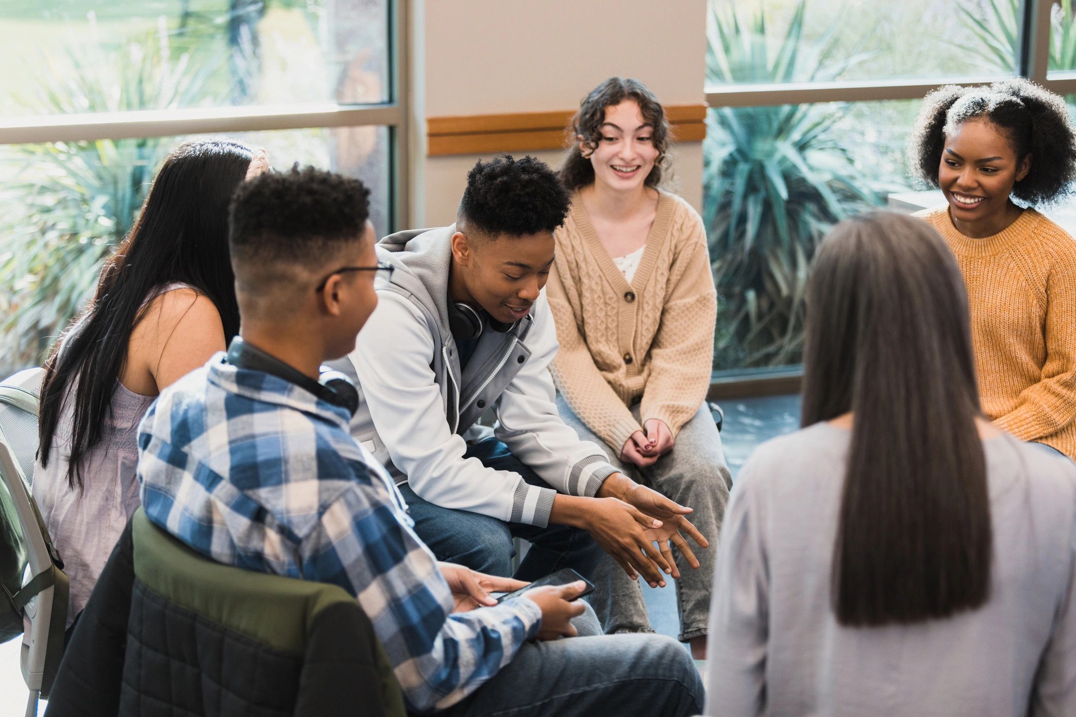 Small group listening and supporting a speaker