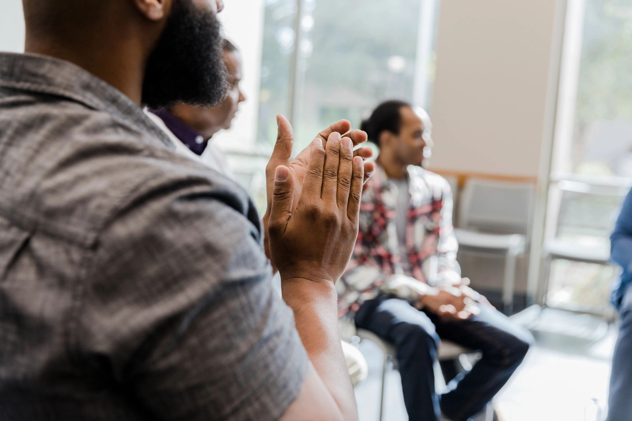 Hands clapping encouragement in a group setting