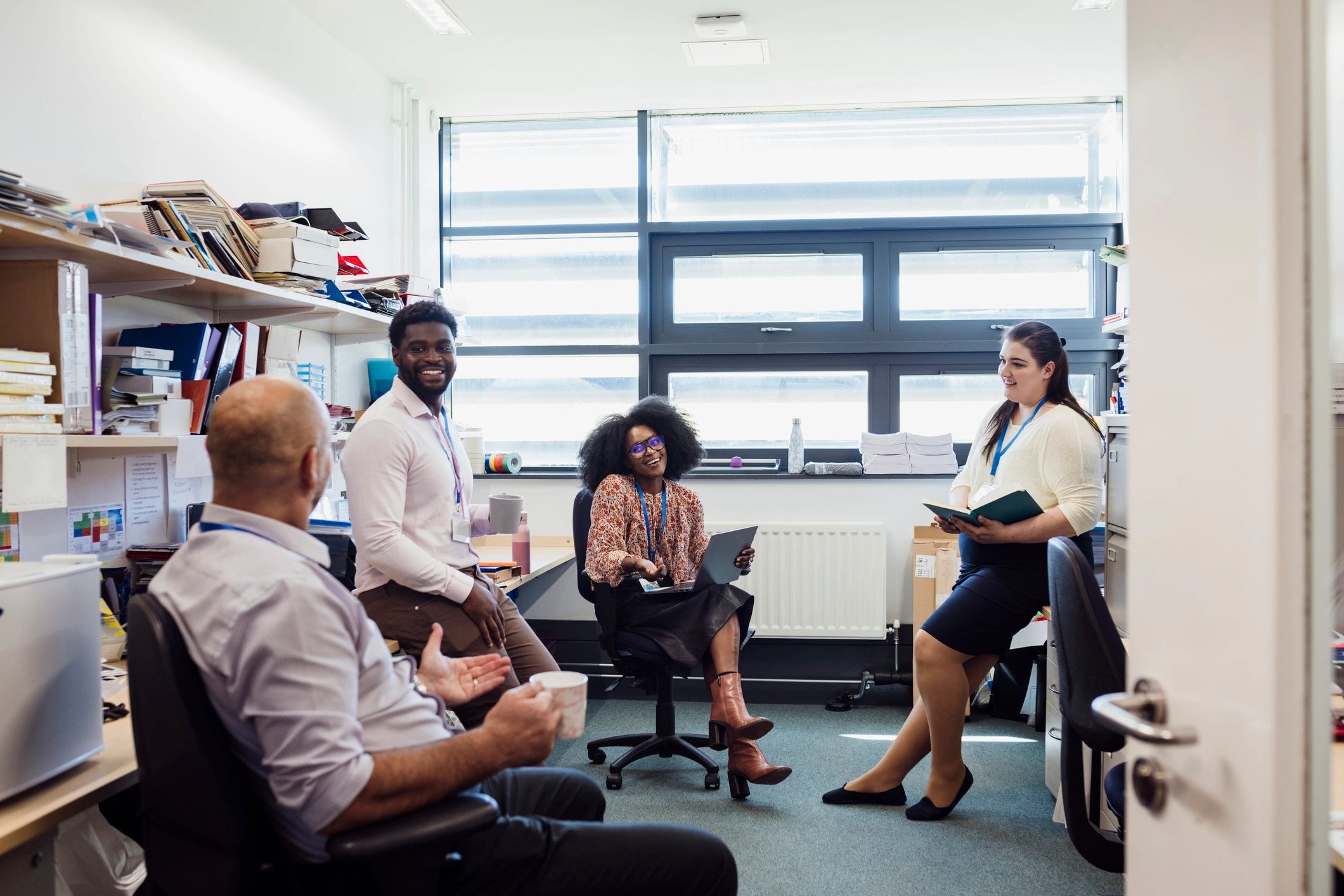 A group gathered in a circle for a supportive meeting