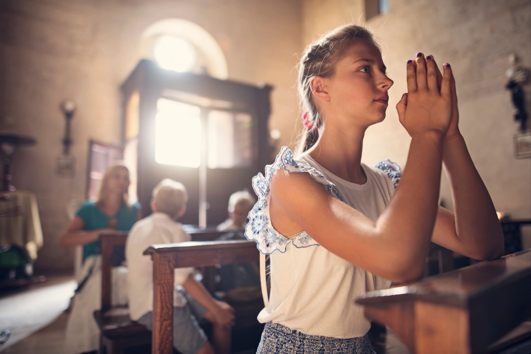 Person praying in a church