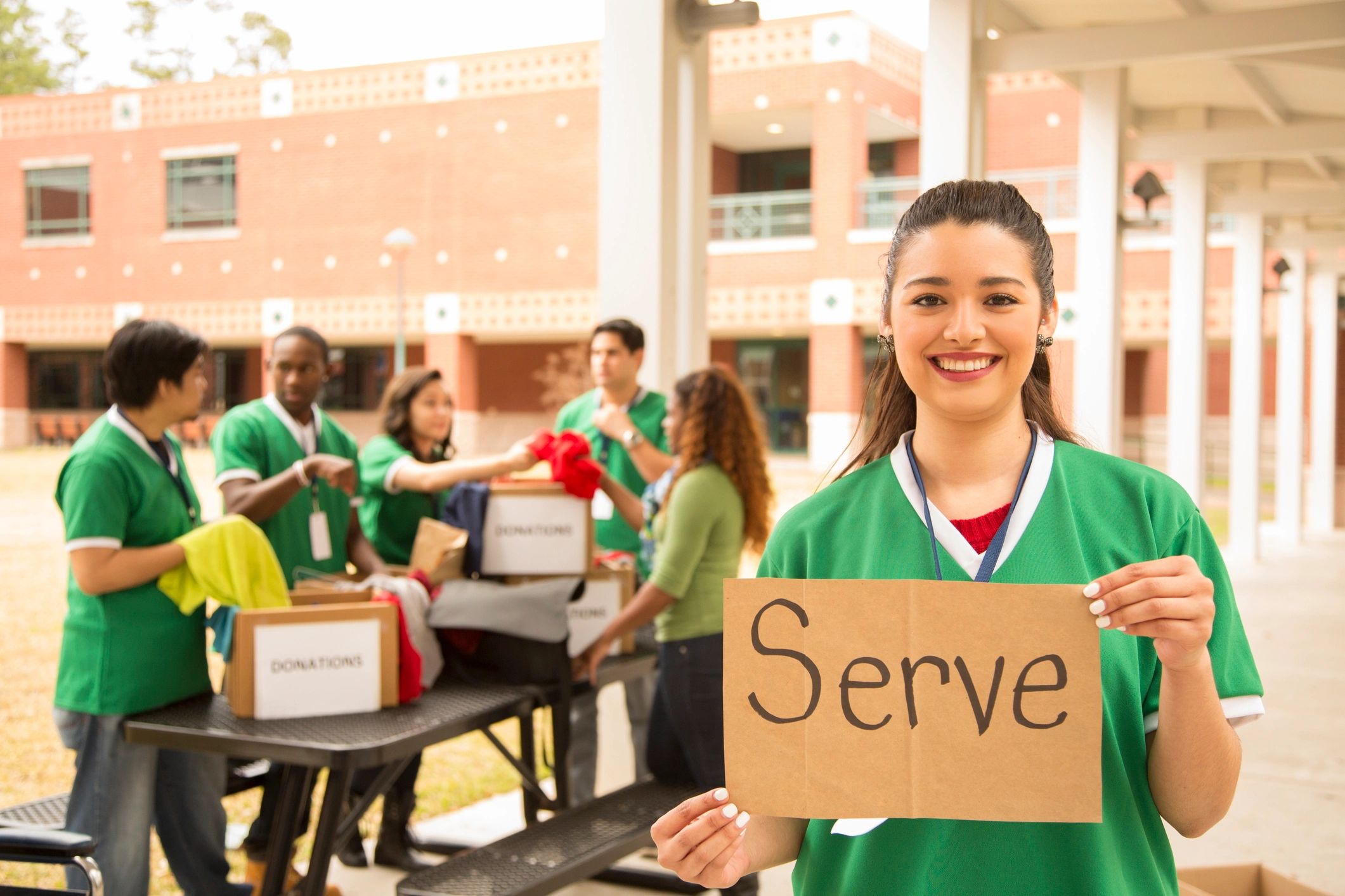 Volunteers receiving clothing donations as an act of community care
